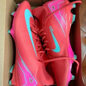 Nike Red and Pink soccer Cleats with Teal Accents